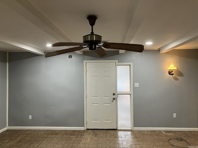 foyer with beamed ceiling and ceiling fan