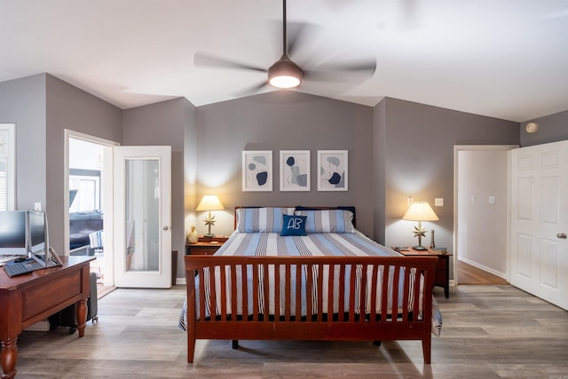 bedroom with light hardwood / wood-style flooring and vaulted ceiling