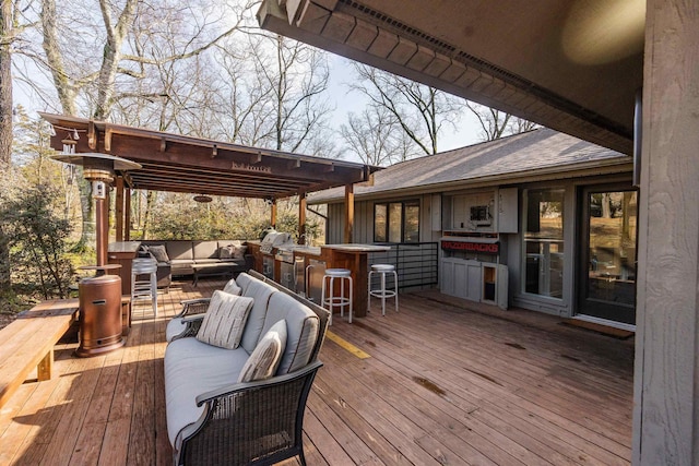 wooden terrace with an outdoor living space, exterior bar, and a pergola