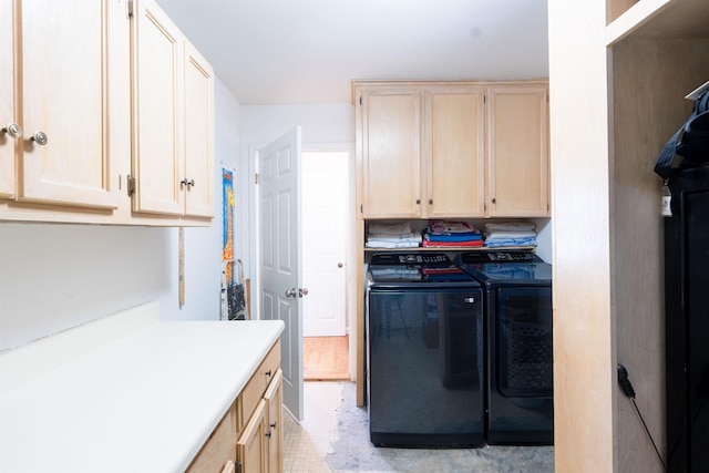 laundry area with cabinets and washing machine and dryer