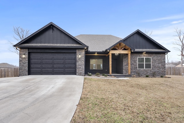 view of front facade with a garage and a front lawn