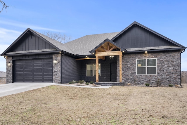 craftsman-style home with a garage and a front lawn