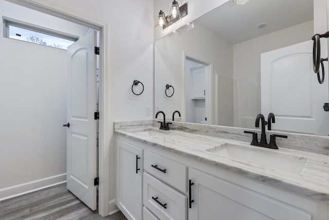 bathroom featuring vanity and hardwood / wood-style floors