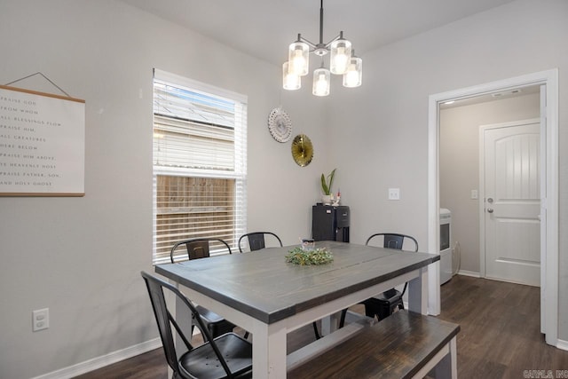 dining space with an inviting chandelier and dark wood-type flooring