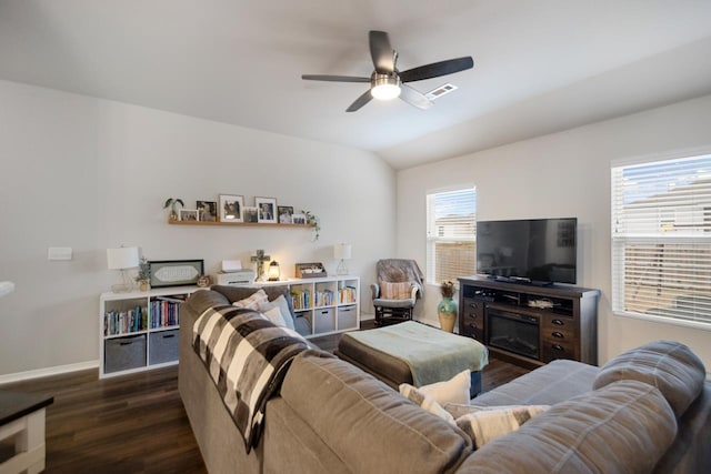 living room with vaulted ceiling, ceiling fan, and dark hardwood / wood-style flooring