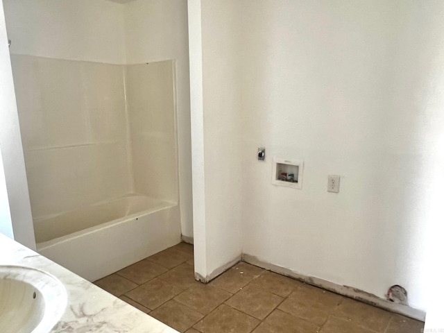 bathroom featuring tile patterned flooring and sink