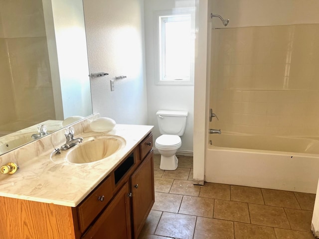 full bathroom featuring vanity, tile patterned flooring, shower / washtub combination, and toilet