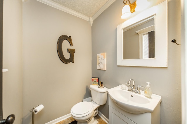 bathroom with crown molding, vanity, toilet, and a textured ceiling