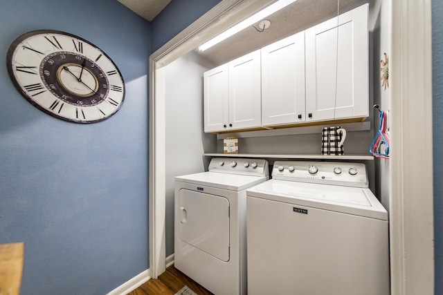 laundry room featuring separate washer and dryer, dark hardwood / wood-style floors, and cabinets