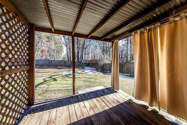 wooden terrace featuring a lawn