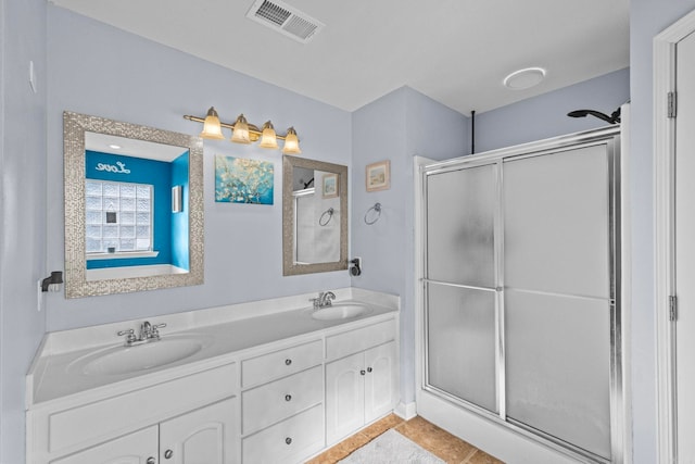 bathroom with an enclosed shower and vanity