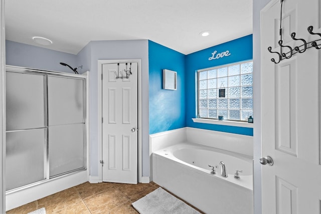 bathroom with tile patterned floors and separate shower and tub