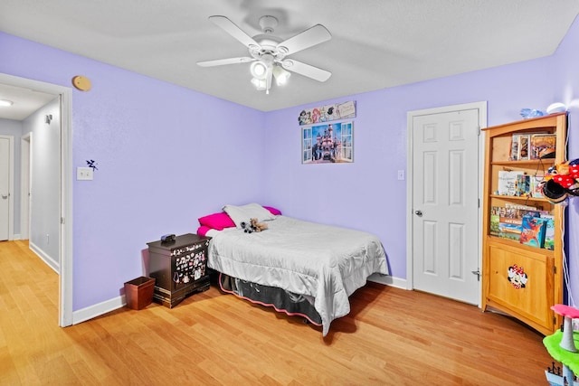 bedroom featuring wood-type flooring and ceiling fan