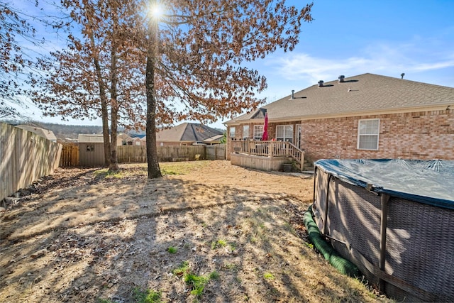 view of yard with a wooden deck