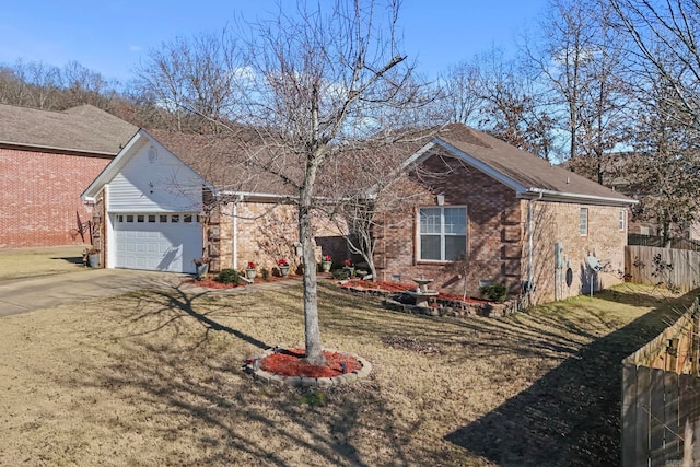 view of front of house featuring a garage and a front lawn