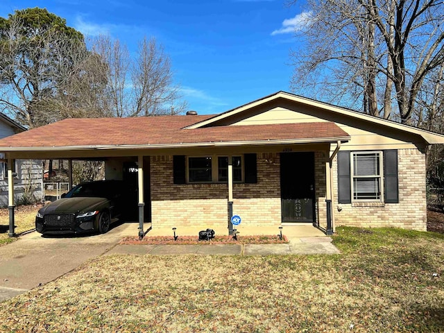 ranch-style home with a front lawn and a carport