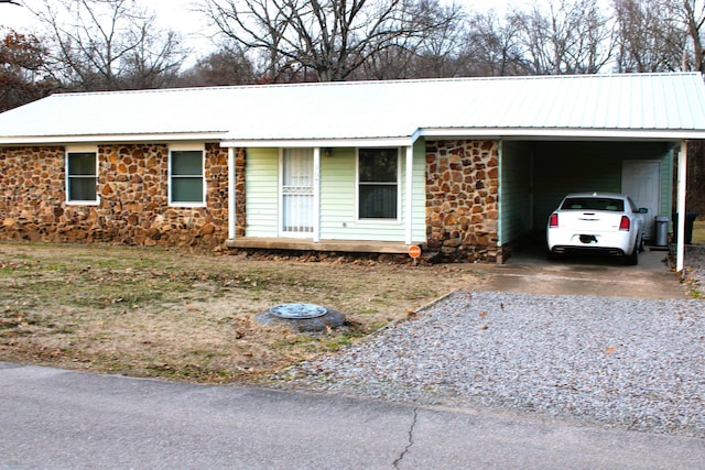 ranch-style home with a carport