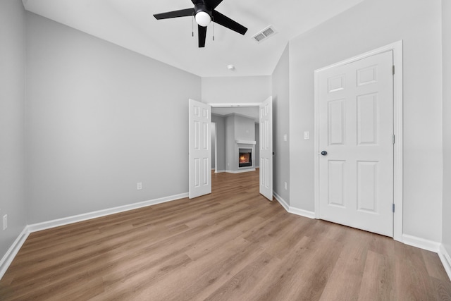 interior space with light hardwood / wood-style floors and ceiling fan