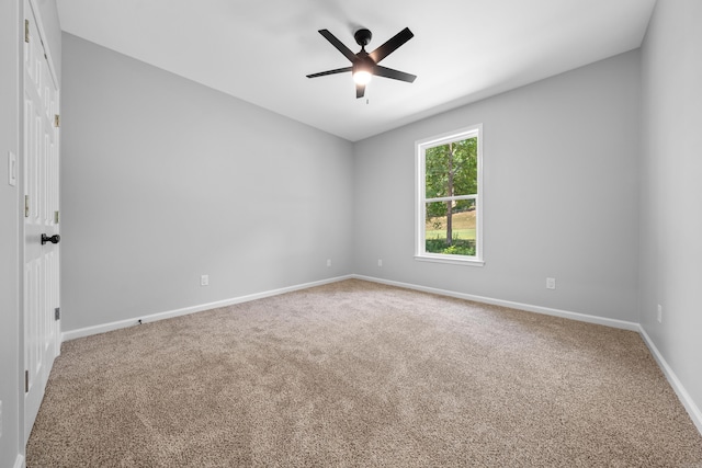 carpeted empty room with ceiling fan