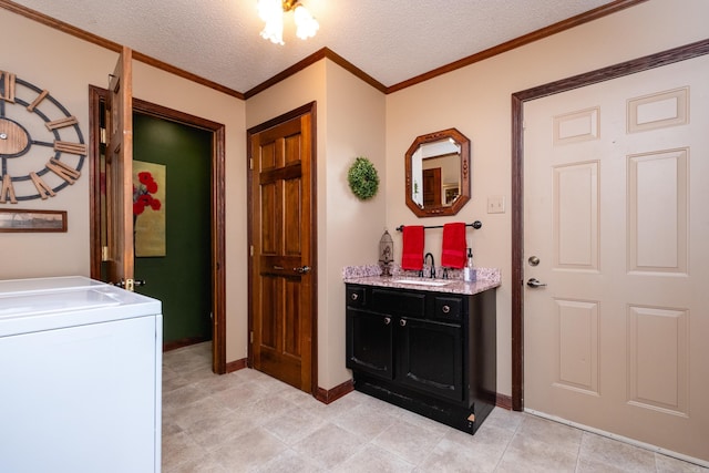 laundry room with ornamental molding, wet bar, washer / dryer, and a textured ceiling