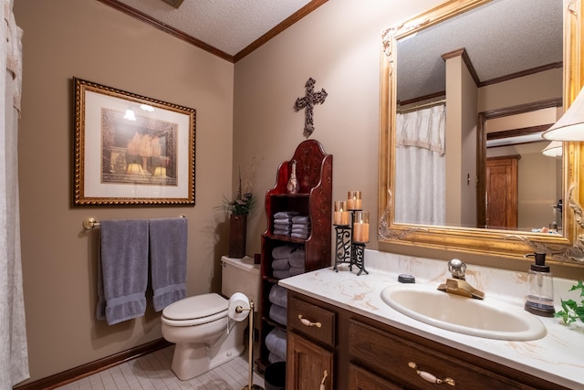 bathroom with vanity, ornamental molding, toilet, and a textured ceiling