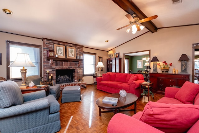 living room with parquet flooring, vaulted ceiling with beams, ornamental molding, a fireplace, and ceiling fan with notable chandelier