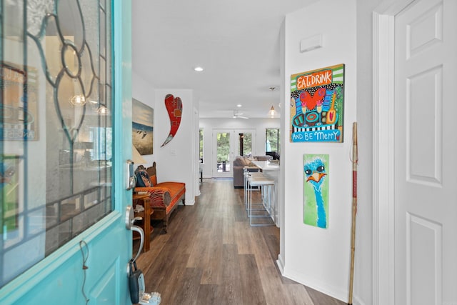 foyer entrance with french doors, ceiling fan, and dark hardwood / wood-style floors