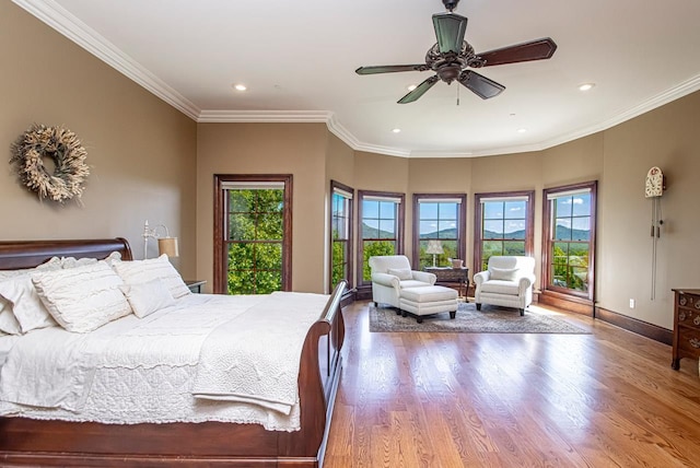 bedroom featuring crown molding and wood-type flooring