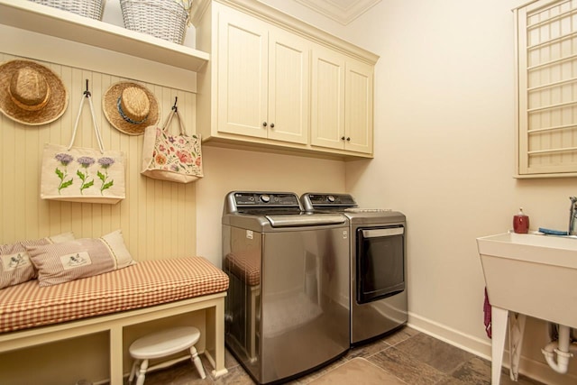 laundry room with cabinets and washing machine and dryer