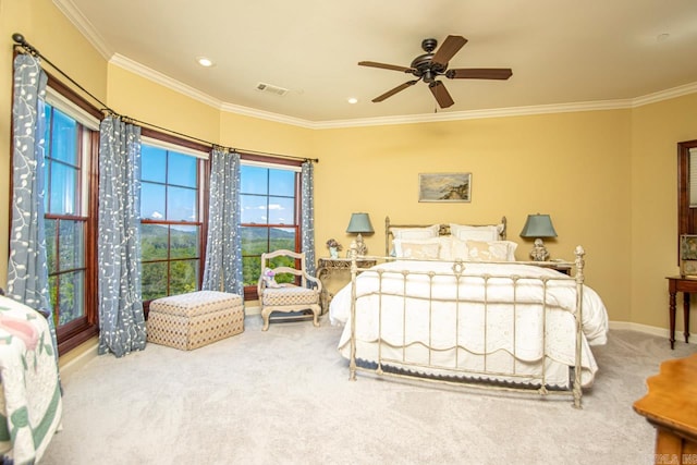 bedroom with ceiling fan, ornamental molding, and carpet flooring