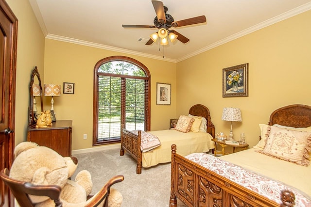 carpeted bedroom featuring ornamental molding and ceiling fan