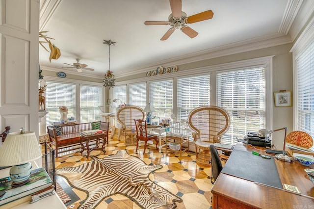 sunroom featuring ceiling fan and plenty of natural light