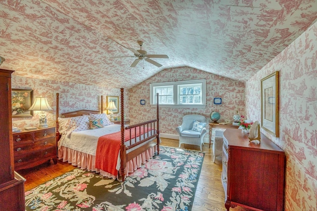 bedroom featuring lofted ceiling and light hardwood / wood-style floors