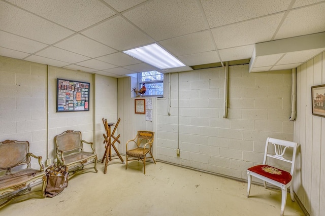 basement featuring a drop ceiling