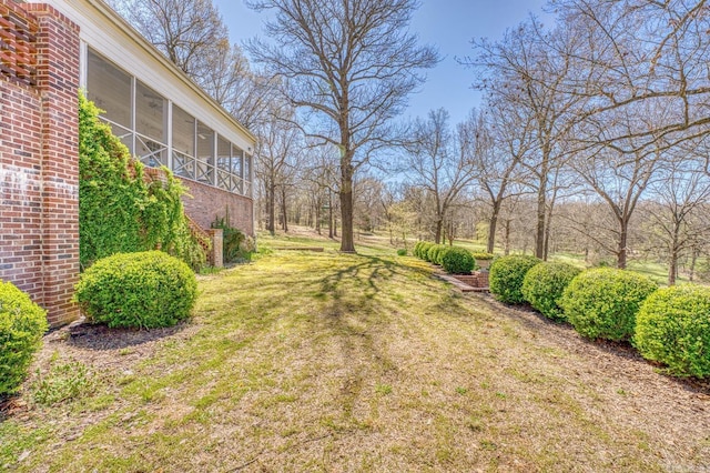 view of yard with a sunroom