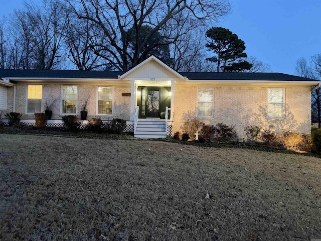 ranch-style house with a yard