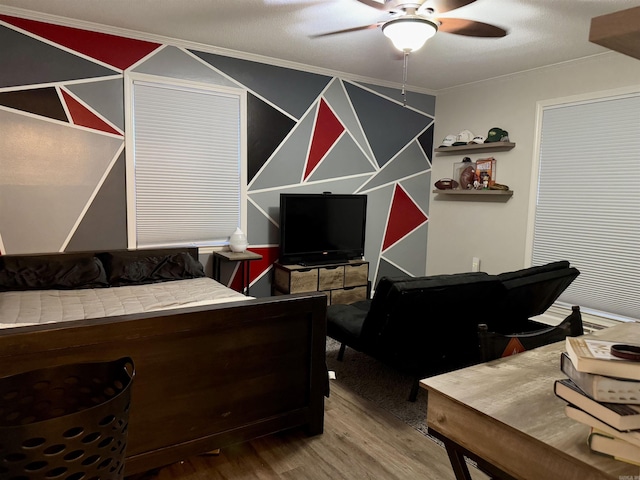 bedroom featuring hardwood / wood-style floors and ceiling fan