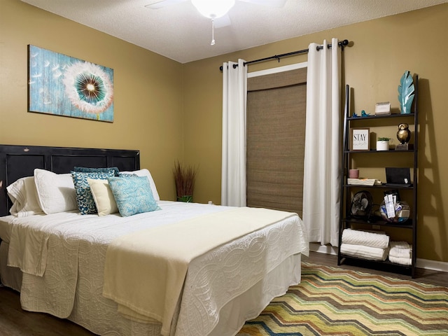 bedroom with a textured ceiling and ceiling fan