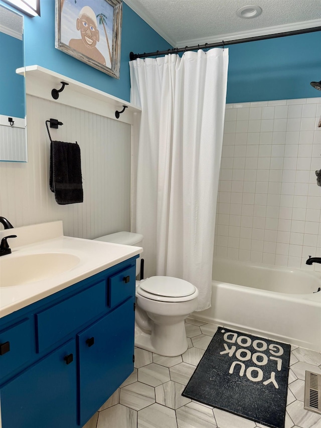 full bathroom with toilet, crown molding, a textured ceiling, vanity, and shower / bath combo with shower curtain