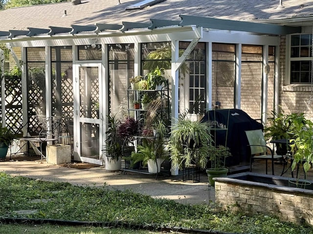 property entrance with a patio