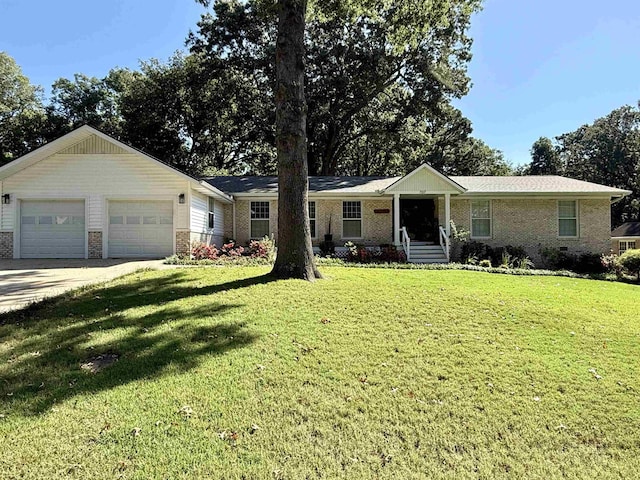 ranch-style house with a garage and a front lawn