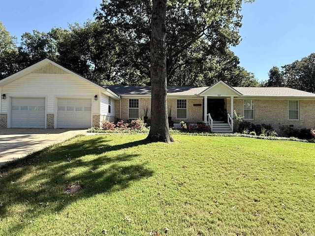 ranch-style home with a garage and a front yard