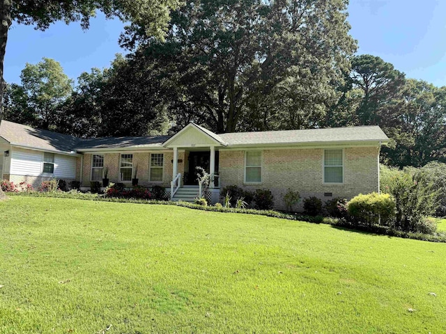 single story home featuring a porch and a front yard