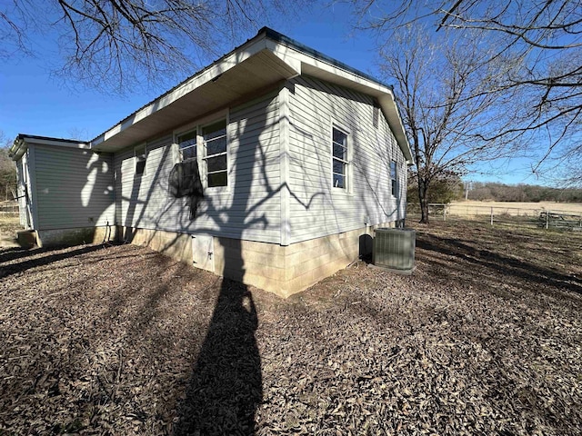 view of side of home with cooling unit