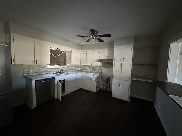 kitchen featuring white cabinetry, sink, dishwasher, and black fridge