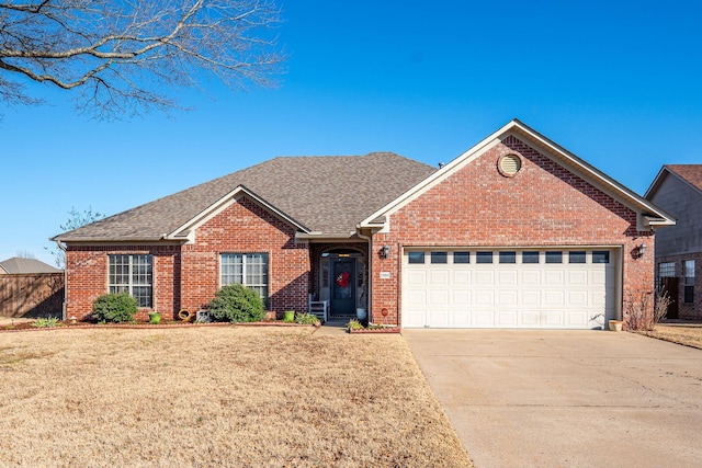 view of front of home with a garage and a front yard