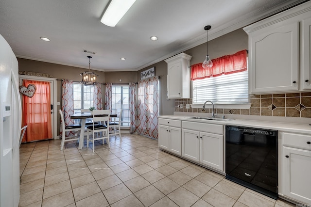 kitchen featuring white cabinetry, dishwasher, sink, and hanging light fixtures