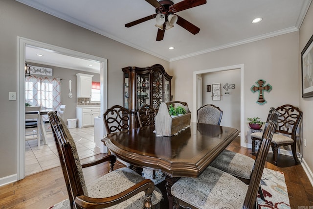 dining room featuring ornamental molding, ceiling fan, and light hardwood / wood-style floors