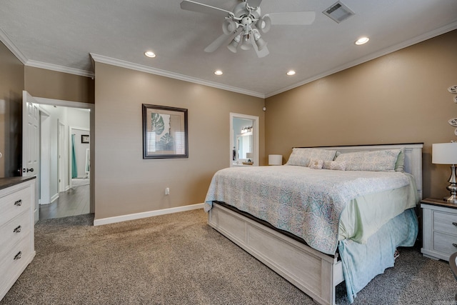 carpeted bedroom with ornamental molding and ceiling fan