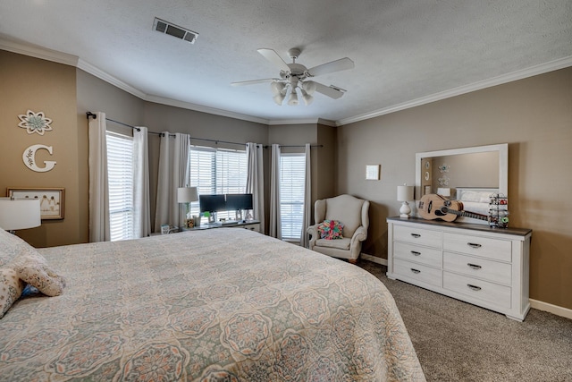 bedroom with dark colored carpet, ornamental molding, ceiling fan, and a textured ceiling